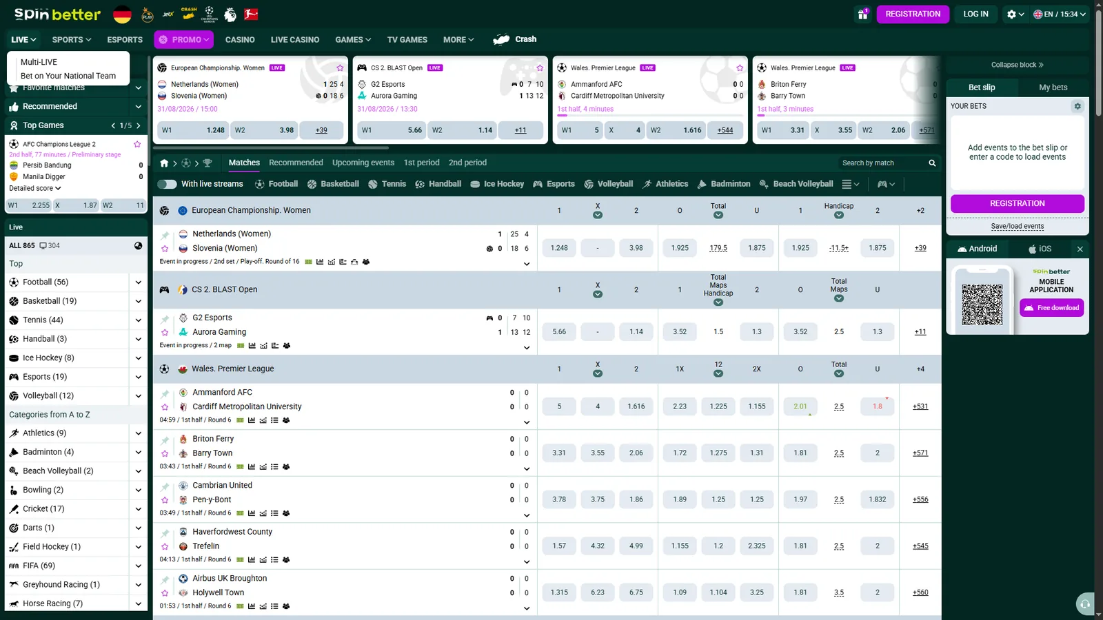 SpinBetter live betting page showing football, tennis, esports and volleyball events with in-play odds and a bet slip panel